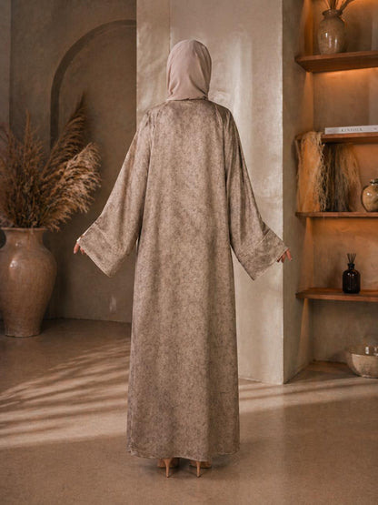 Elegant beige abaya with a soft flowy fit and wide sleeves